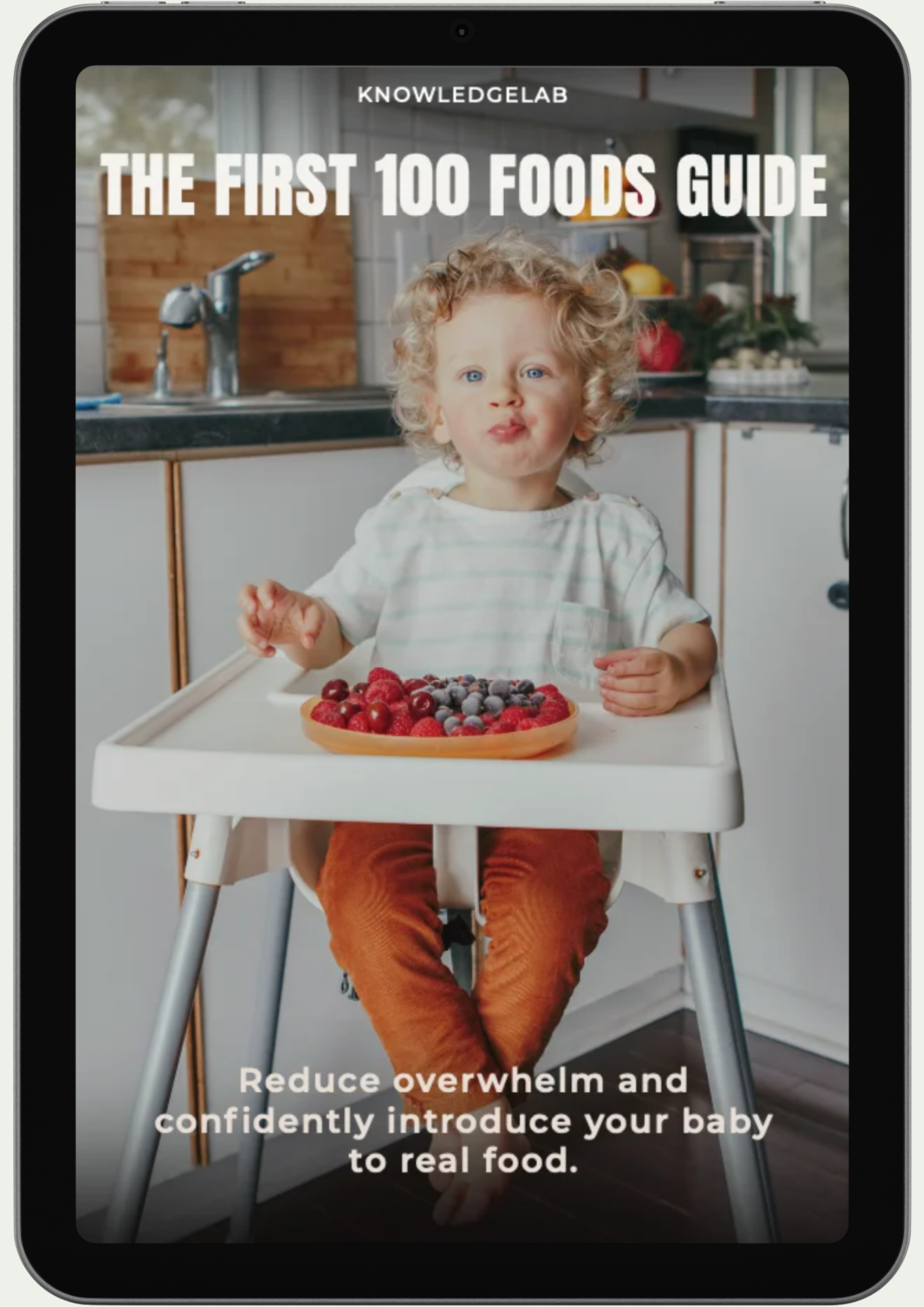 A toddler with curly blonde hair eats fruit in a high chair. The image text reads: “The Calm Parenting Collection. Calm parenting starts here—confidently introduce your baby to real food.”.
