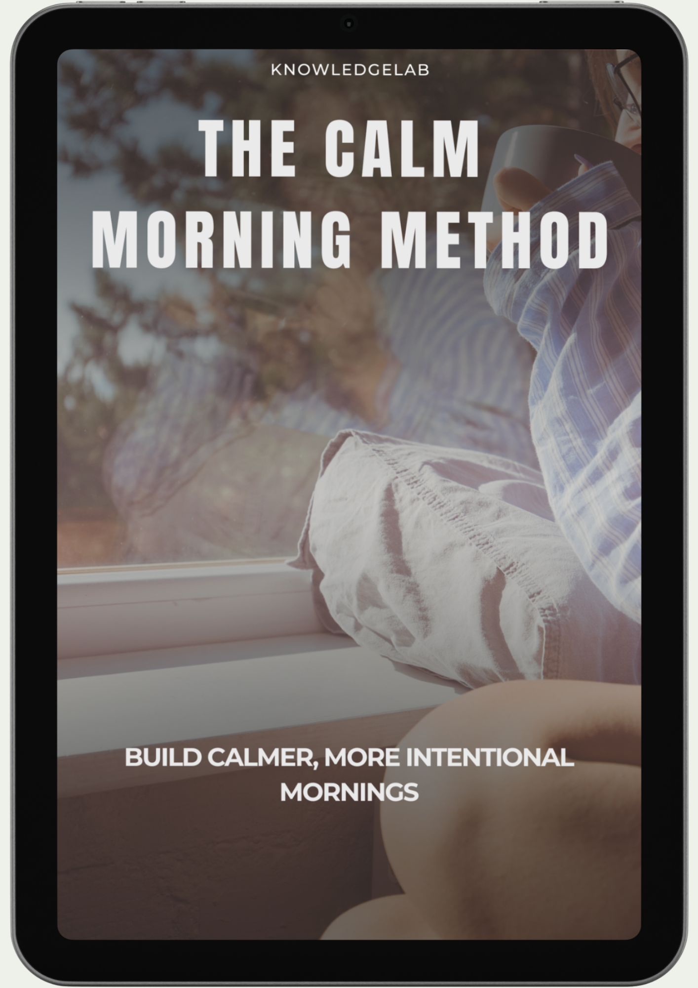 A tablet screen displays an eBook cover from The Best Sellers Collection, focusing on wellness and creating calmer, intentional mornings. In the background, a person by a window holds a mug, embracing peaceful productivity.