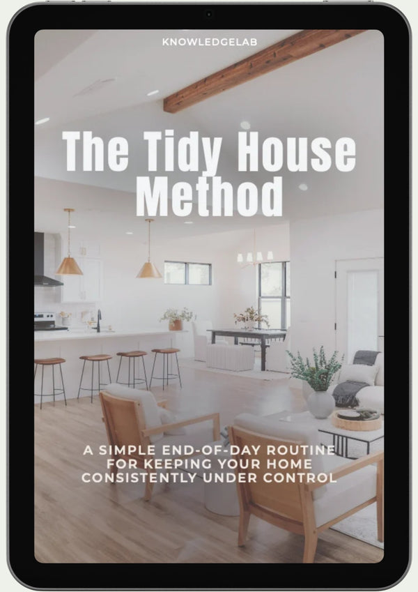 A tablet displays The Tidy House Method ebook cover, showcasing home organization with a modern kitchen and living room—white walls, wooden beams, and minimal decor set the scene for a nightly reset routine.